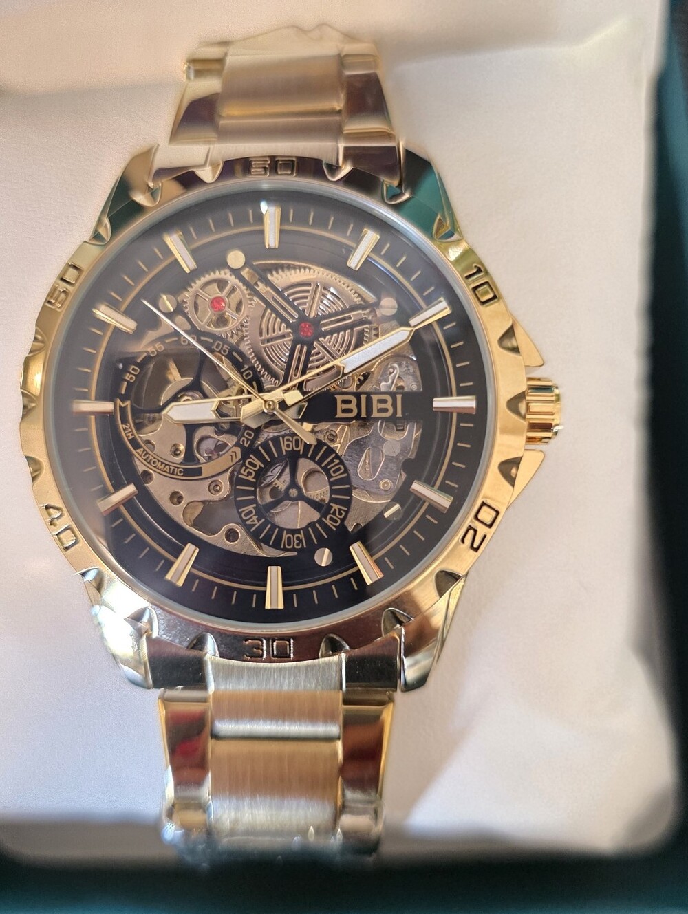 BiBi Gold Tone Skeleton Dial Watch with Black Accents